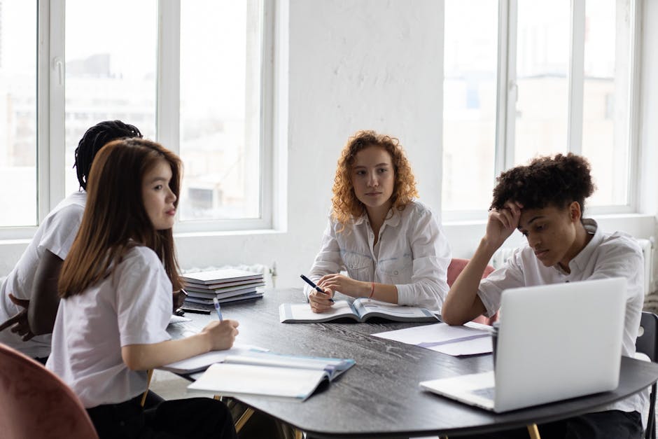 Focused young multiracial coworkers working on business project