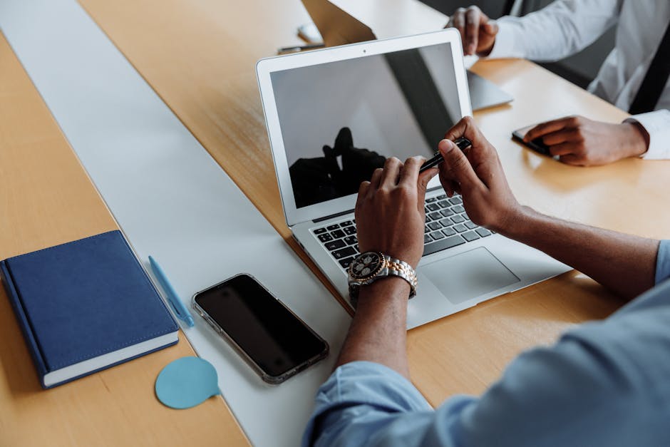 Close-up of a business meeting with laptops and smartphones